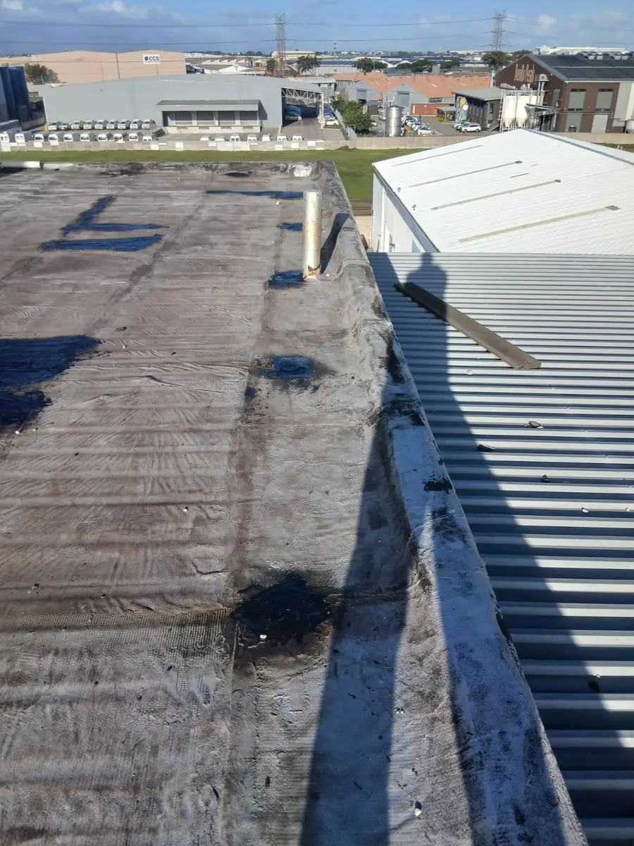 Parapet and roof edge waterproofing on a commercial building